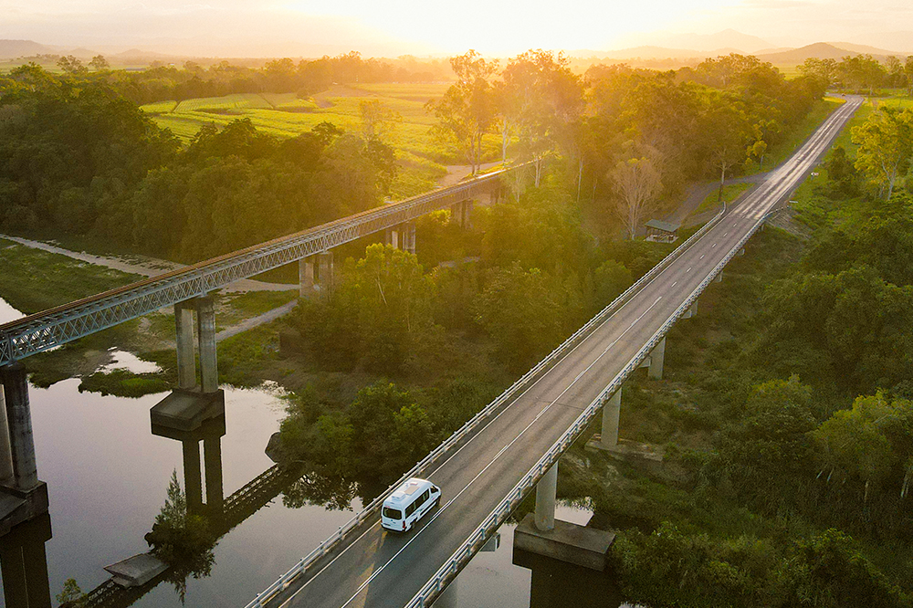 Apollo-AU-QLD-Euro-Tourer driving on bridge over river