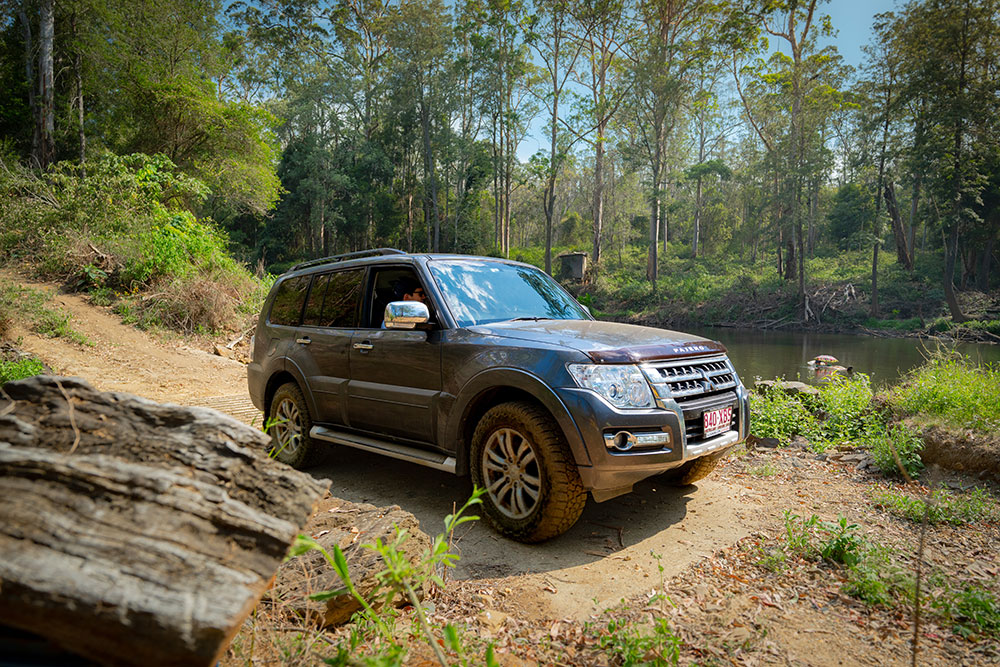 A 4WD crossing a gully at Jimna.