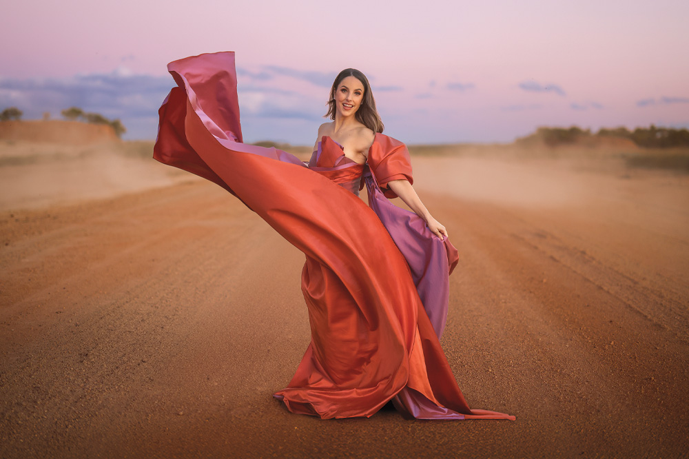 Woman promoting Festival of Outback Opera.