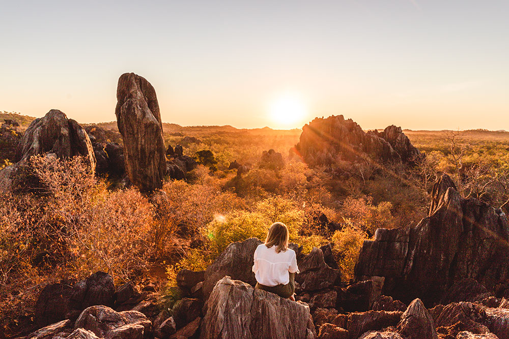 A woman takes in the view of Balancing Rock at Chillagoe.