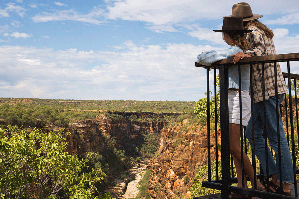 Two people at a lookout above Porcupine Gorge.