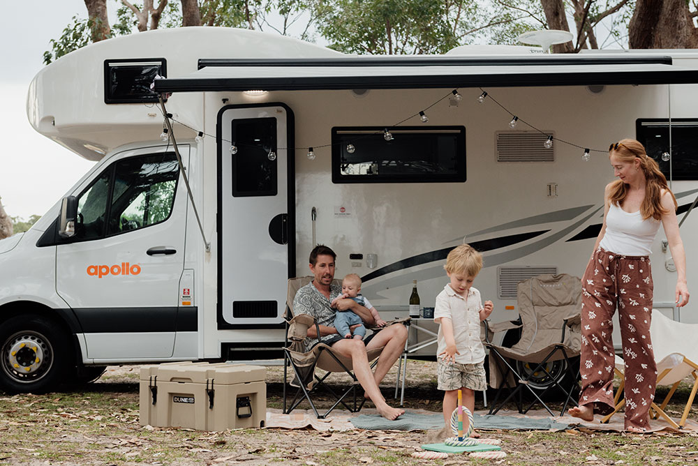 Family in front of Apollo campervan.