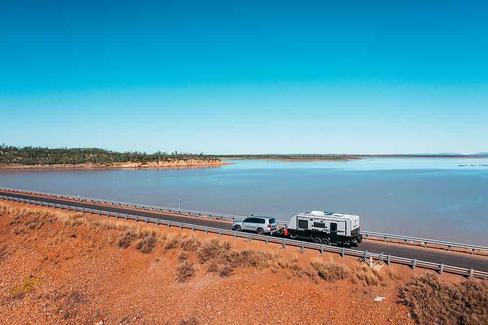Car towing a caravan at Lake Maraboon.