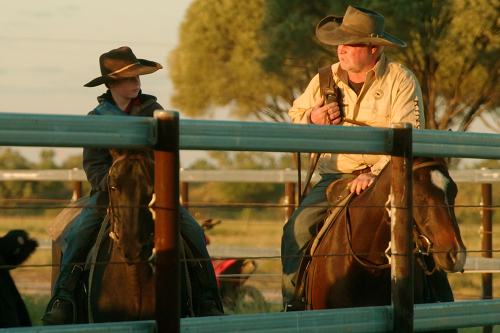 Two participants of the Outback Queensland Cattle drive on horseback.