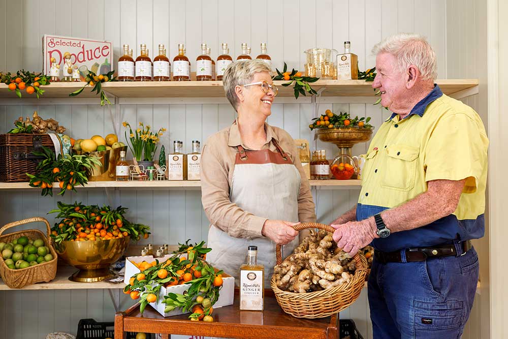 Two people at Cumquats Australia Farm Gate Distillery in Toogoolawah.