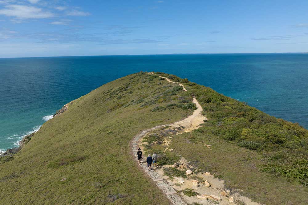 People walkling out to Stockyard Point in Byfield National Park