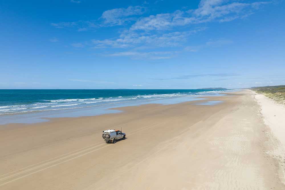 4WD vehicle on Little Five Rocks Beach in Byfield National Park