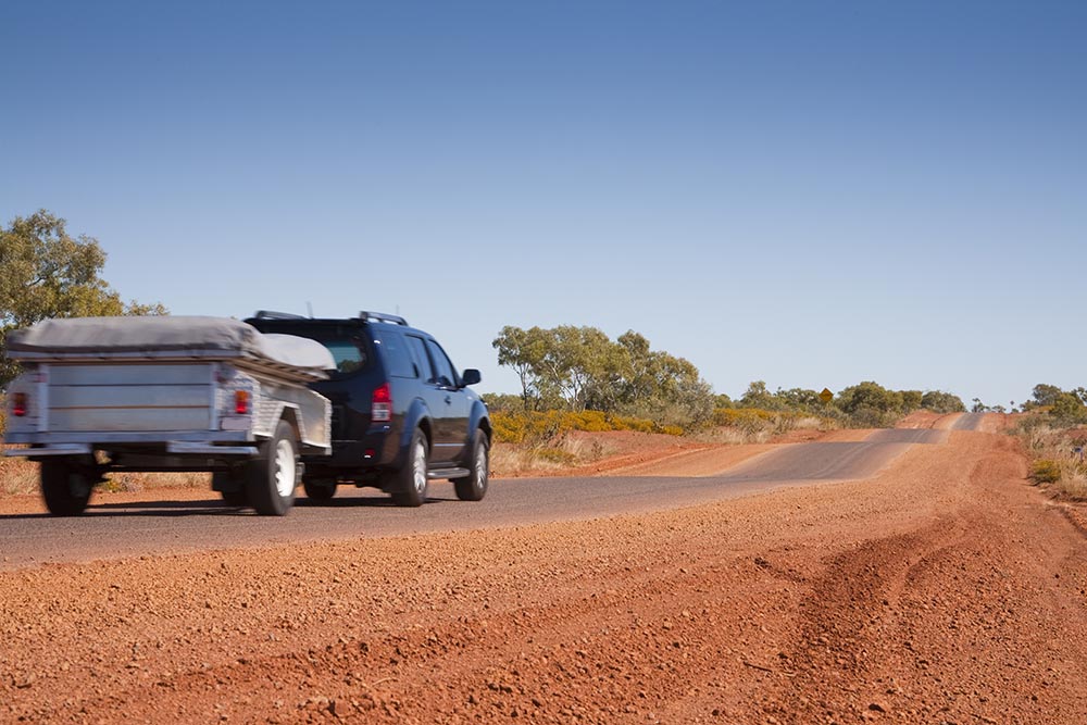 car towing a camper trailer