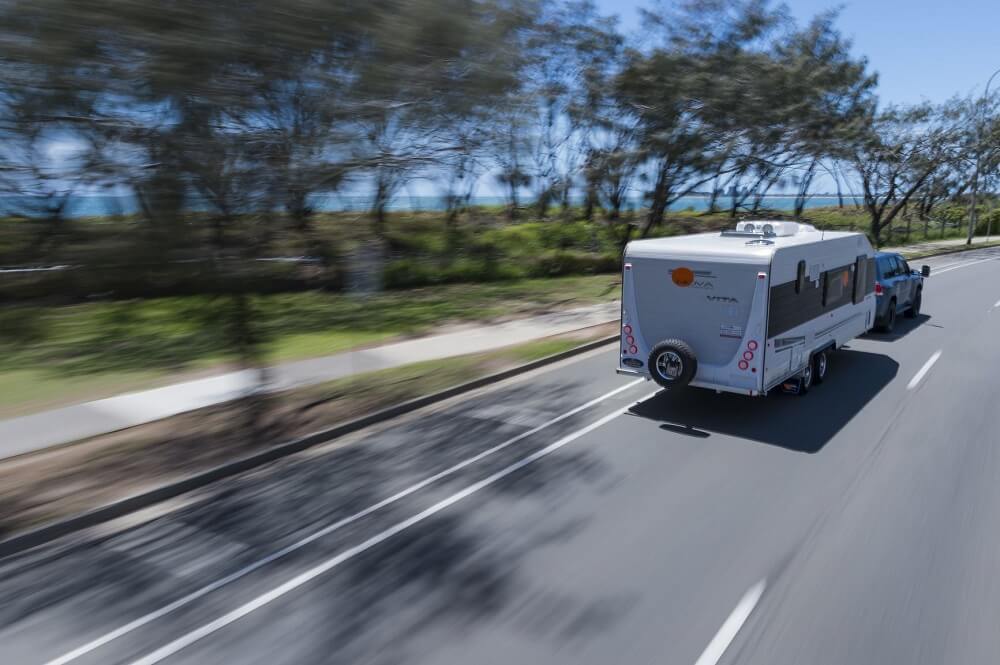 Caravan on the road by the beach.