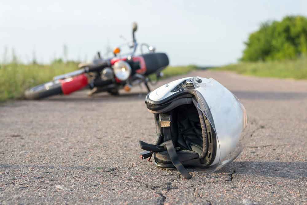 motorbike helmet on road after crash