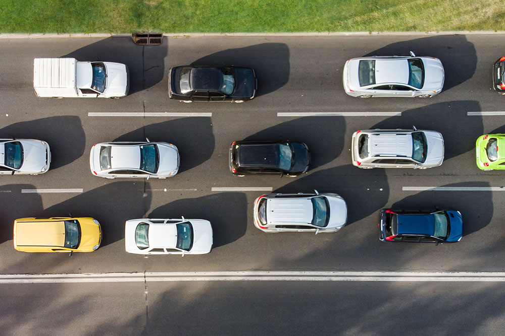 Cars tailgating on a highway.