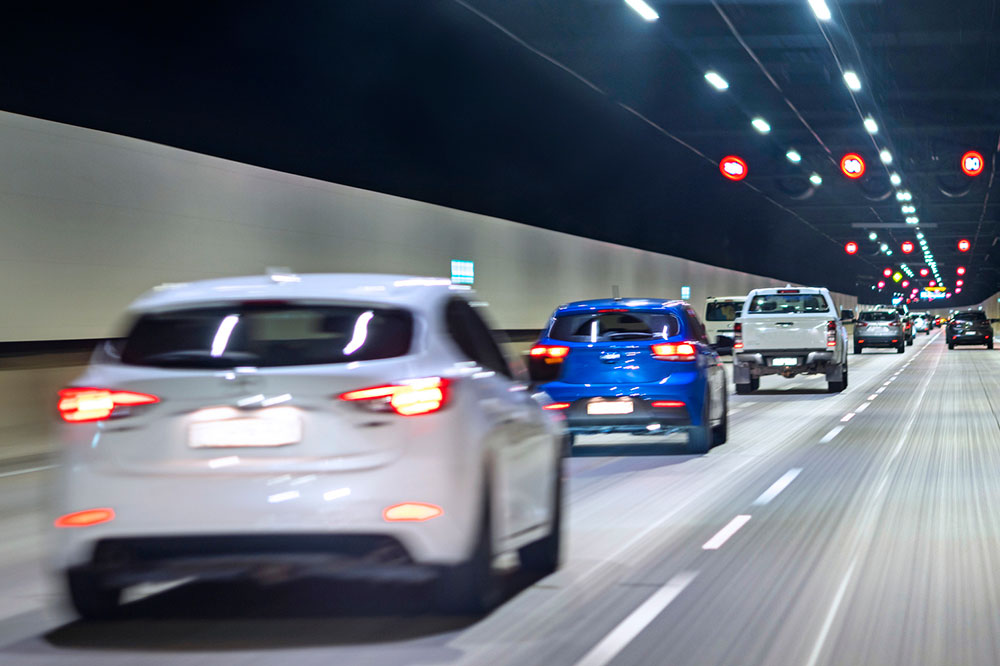 Cars driving too close to each other in a tunnel.