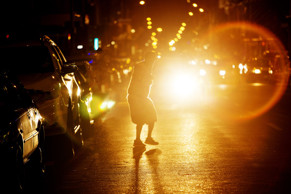 pedestrian on road at night