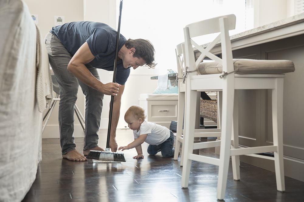 Father and son cleaning house