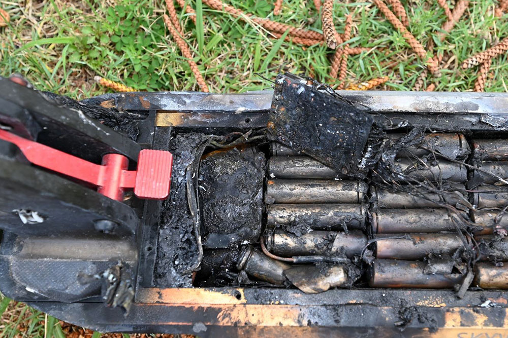 An e-scooter destroyed by fire.