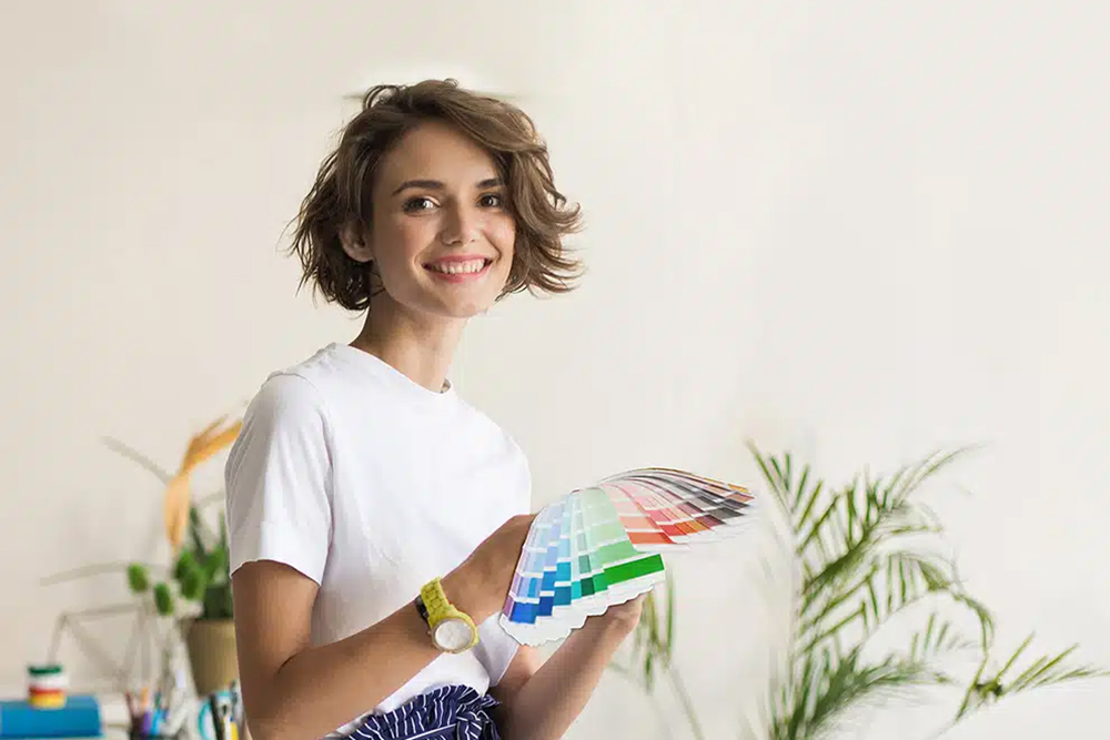 Woman with paint swatches.