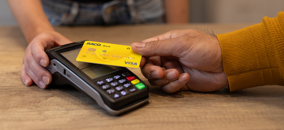 Customer making a contactless payment with RACQ bank card
