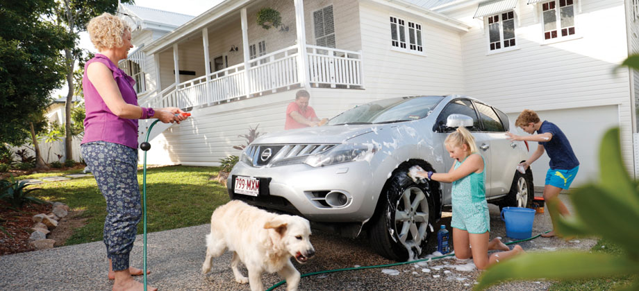 Family washing car at home