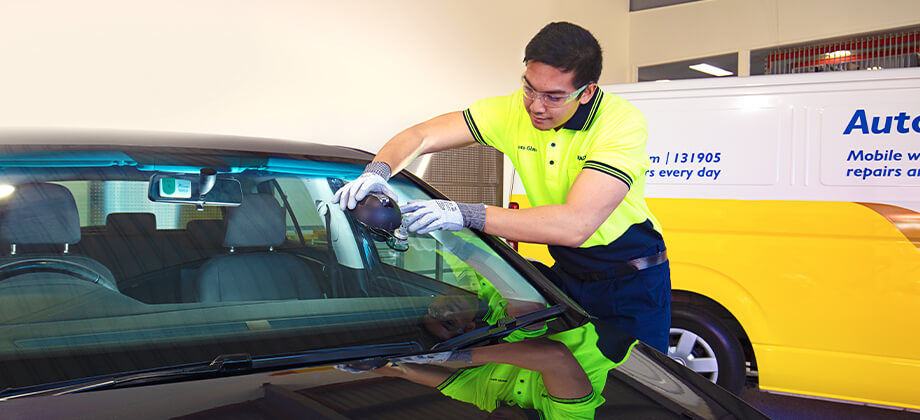 RACQ auto glass staff fixing windscreen chip