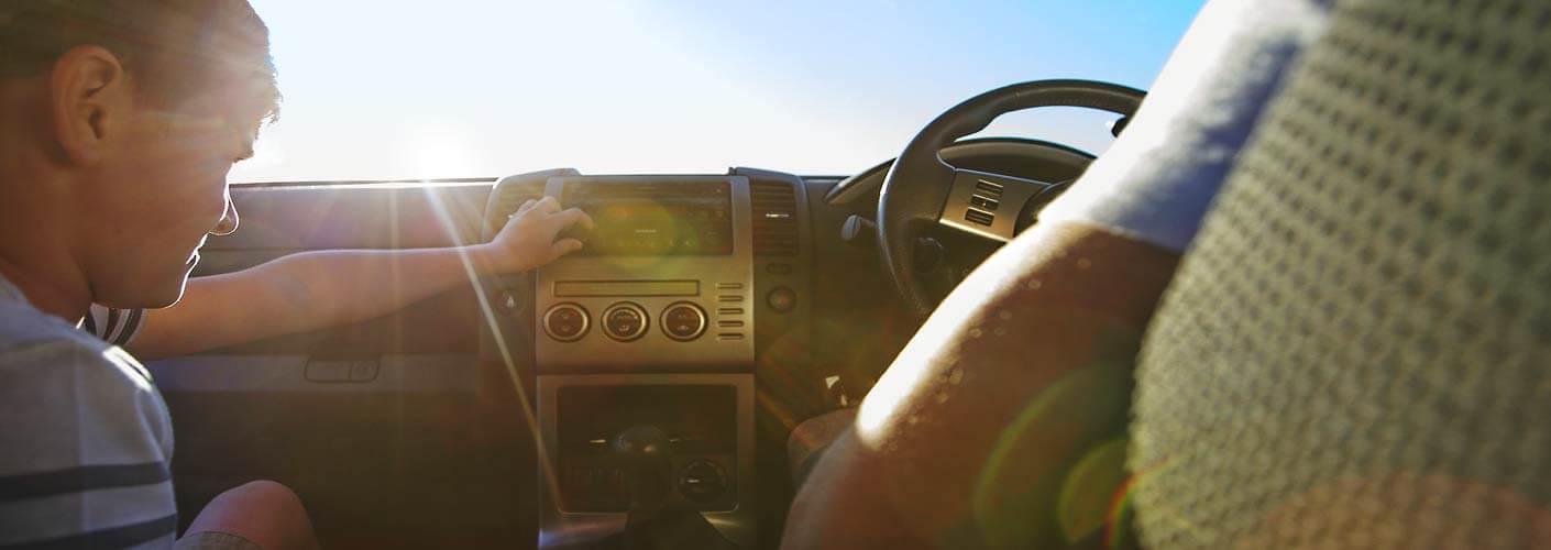 Person turning up the car stereo