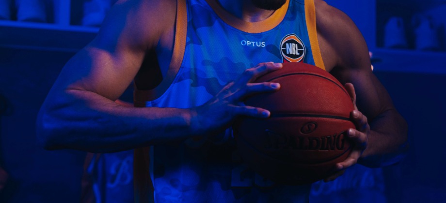 Brisbane Bullets player holding basketball