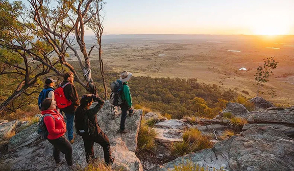 Group of people on a guided tour viewing Carnarvon Gorge