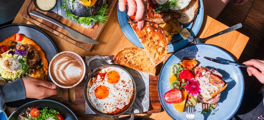 Table full of coffee and brunch food