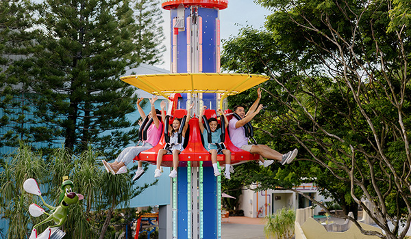 kids and parents on Marvin the Martian Cosmic Boom ride