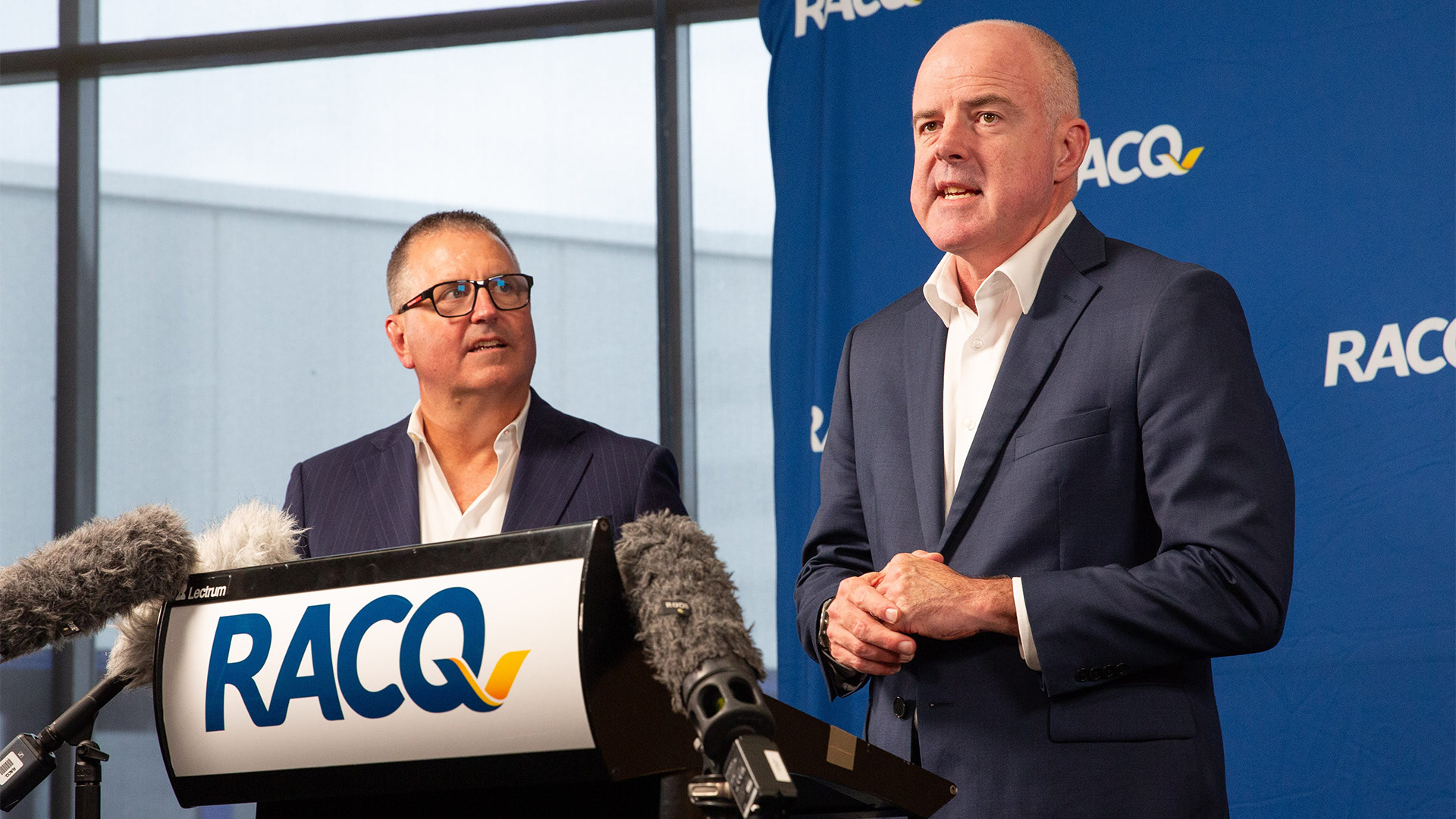 IAG Managing Director and CEO Nick  Hawkins watches David Carter address media at the insurance partnership announcement