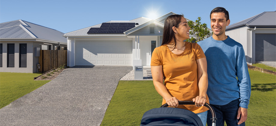 Family outside house with solar panels