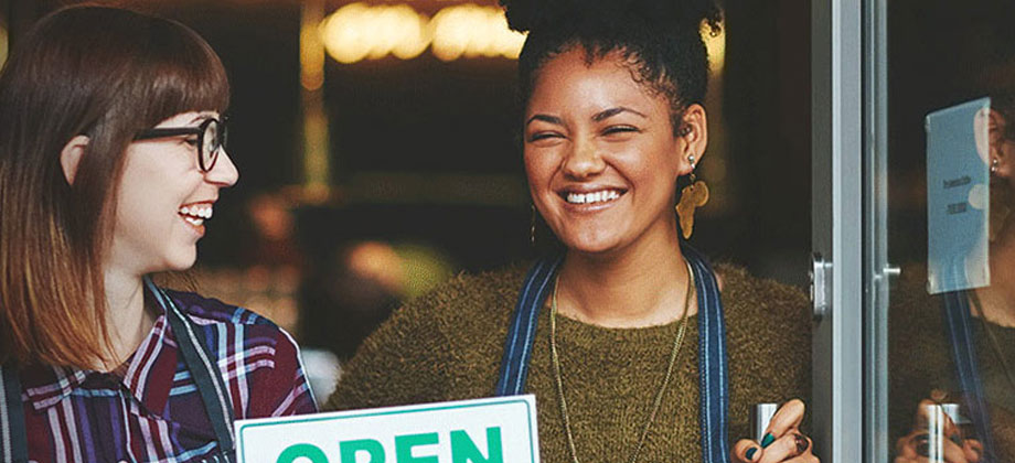 Business owner opening doors