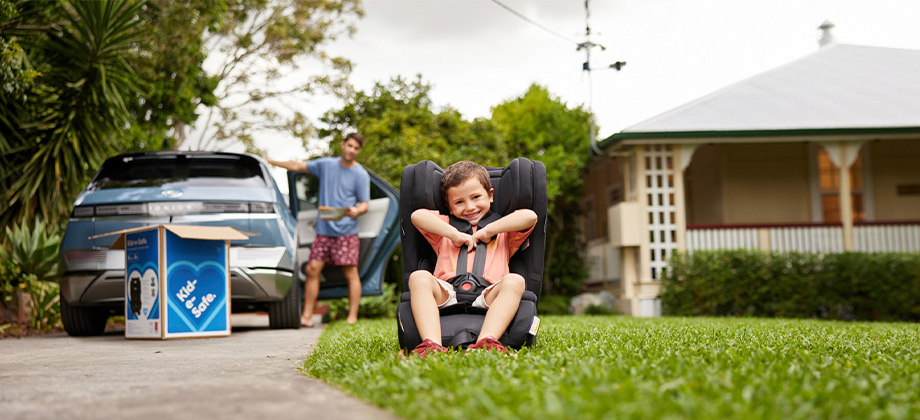 Child seat in front of house
