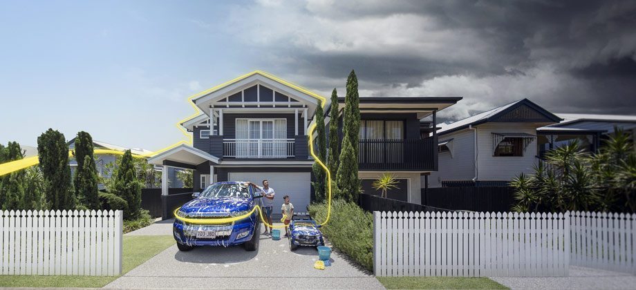 family washing car with storm approaching 