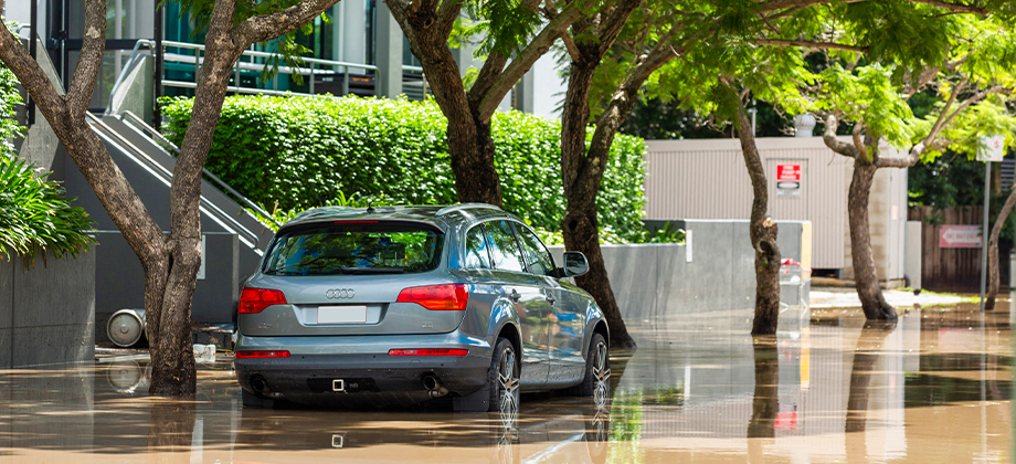 car sunk in dirty water on street