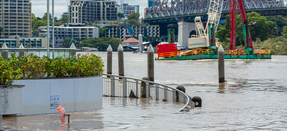 walkway flooded next to bridge