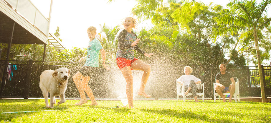 Kids playing in the background with pet