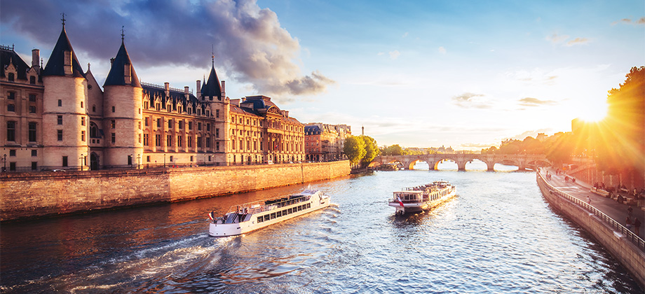Cruise ships at sunset going up river in France