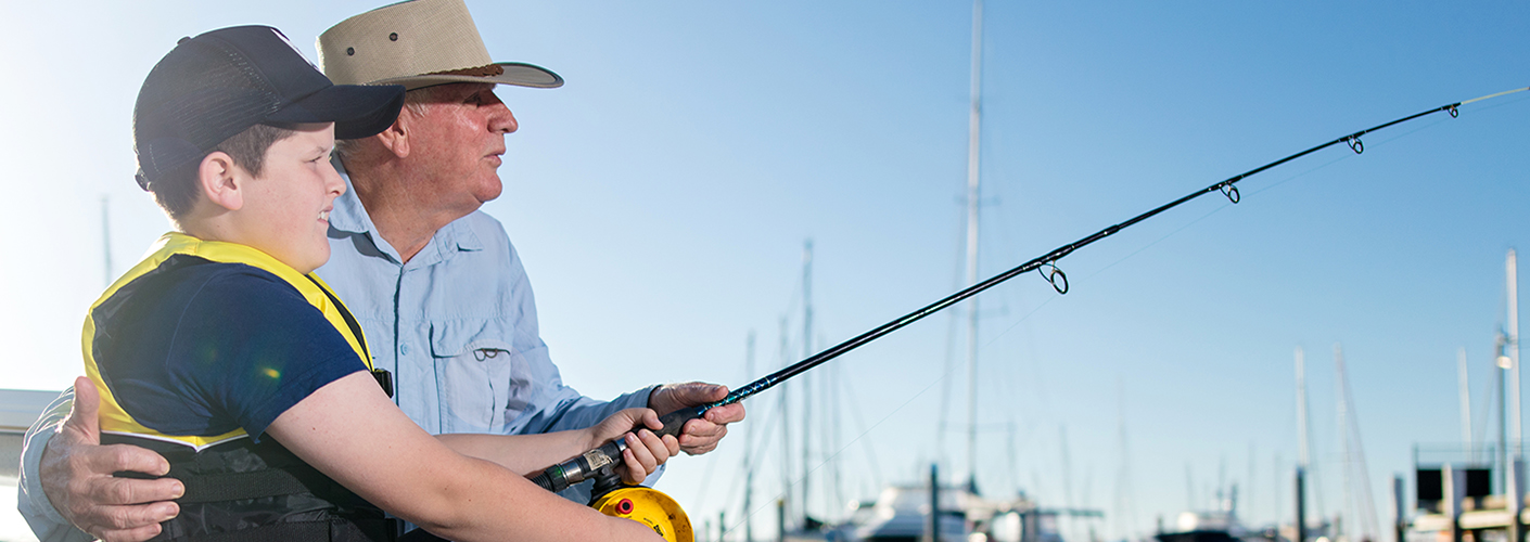 mature-man-fishing-with-little-boy