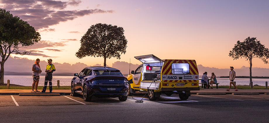 racq workers charging vehicle