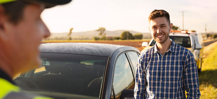 Guy on the side of road needing roadside assistance