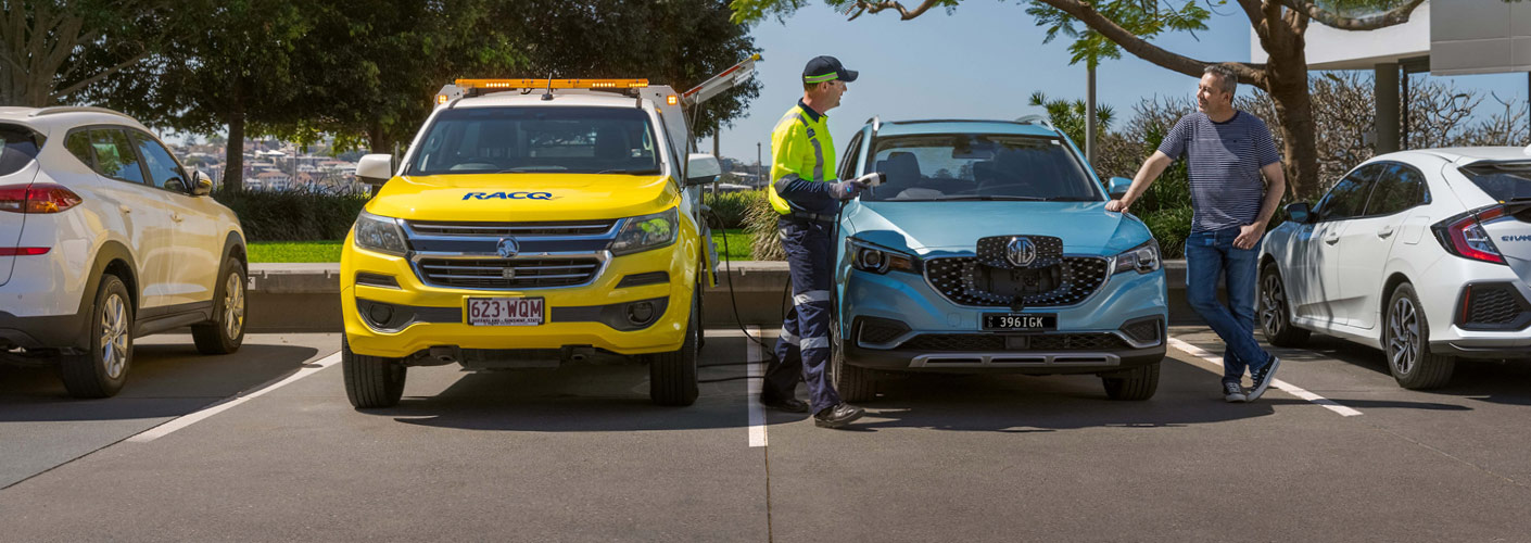 Roadside patrol standing with electric vehicle