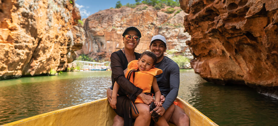 Family travelling on river cruise in Australia