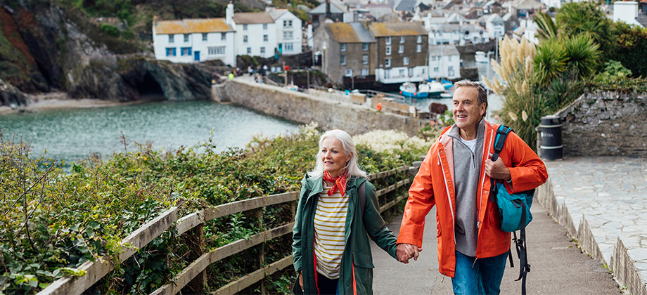 senior couple holding hands travelling overseas