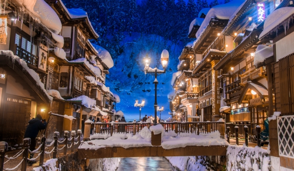 Ginzan onsen in winter with buildings covered in snow
