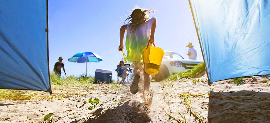 girl-running-on-beach-1410x500