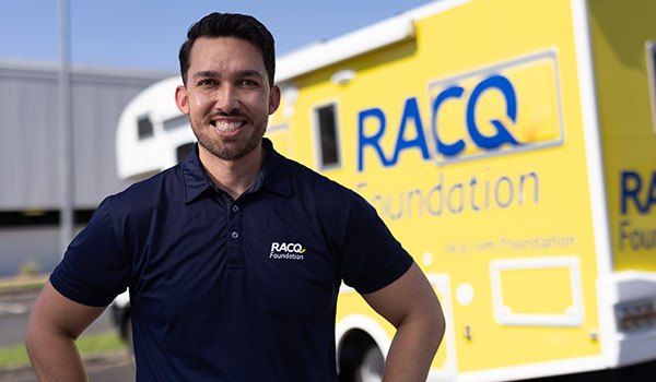 RACQ staff in front of RACQ Foundation truck