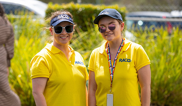 RACQ staff in yellow polos outside