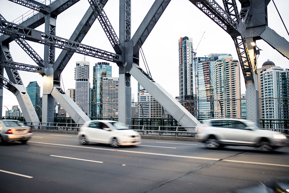 Cars driving across the story bridge
