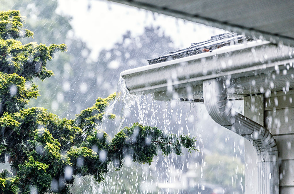 Heavy rainfall on house roof