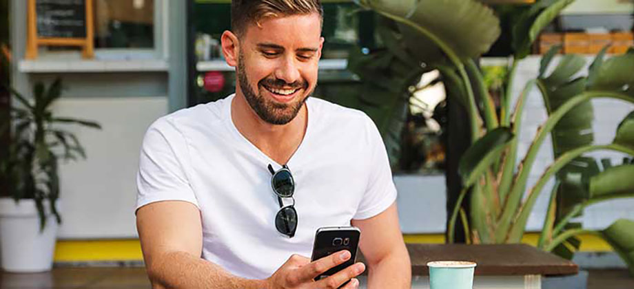 Man using mobile at cafe